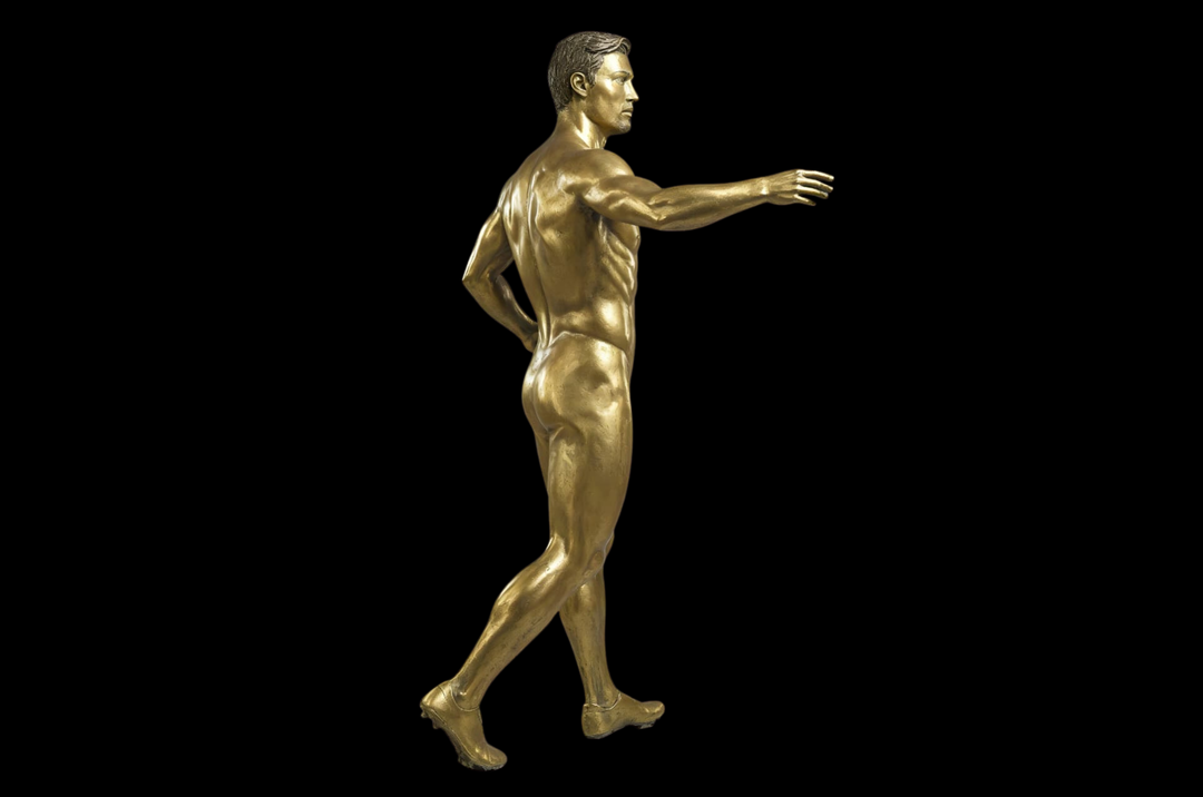 Gold statue of a nude male figure on a black background Cristiano Ronaldo Golden Doll